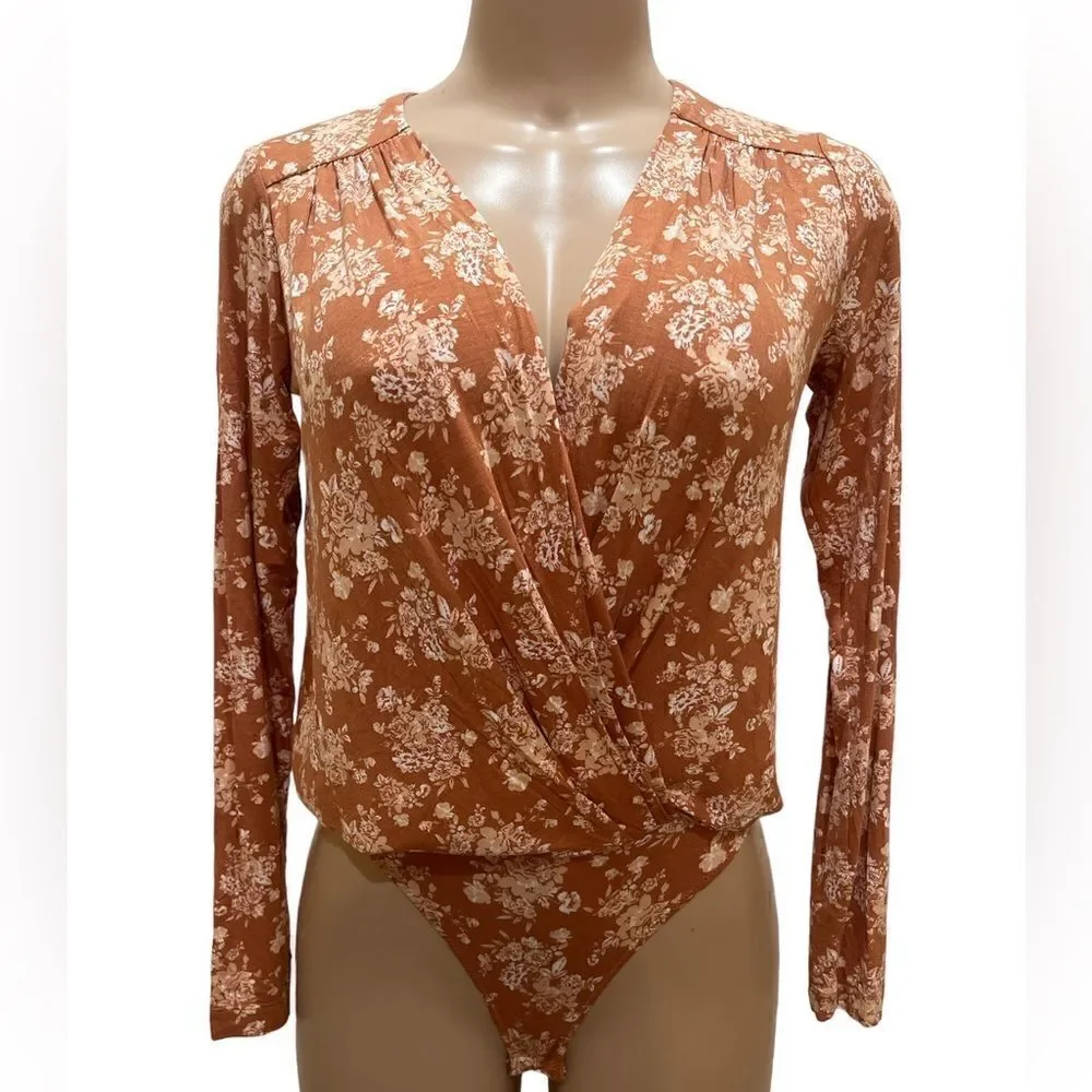 NWT-FREE PEOPLE Turnt Bodysuit